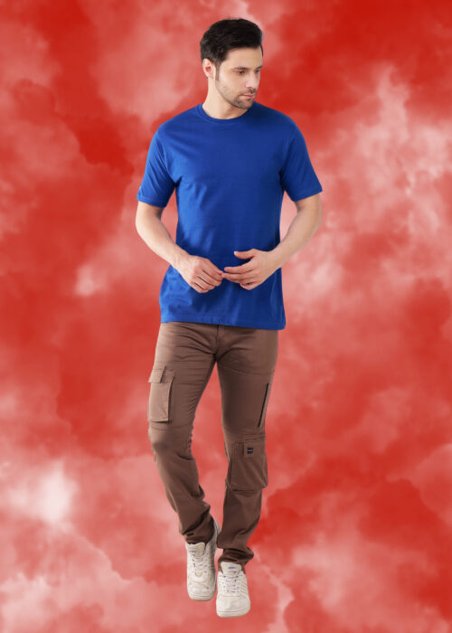 Upgrade your everyday wardrobe with this men’s round neck royal blue regular fit T-shirt. Crafted from soft, breathable fabric, it ensures all-day comfort with a smooth feel. The classic crew neck and relaxed fit deliver a timeless, versatile style—perfect for casual wear, layering, or street looks. Pair it with jeans or cargos for a sharp and confident outfit. A must-have essential for a bold and modern look.