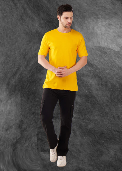 Brighten up your wardrobe with this men’s round neck yellow regular fit T-shirt. Made from soft, breathable fabric, it ensures all-day comfort and a lightweight feel. The classic crew neck and relaxed fit offer a timeless look, perfect for casual outings, daily wear, or layering. Pair it effortlessly with jeans or cargos for a bold and stylish appearance. A must-have essential for a fresh and vibrant everyday style.